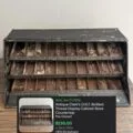 Sold: antique Clark's O.N.T. Boilfast thread display cabinet, store countertop