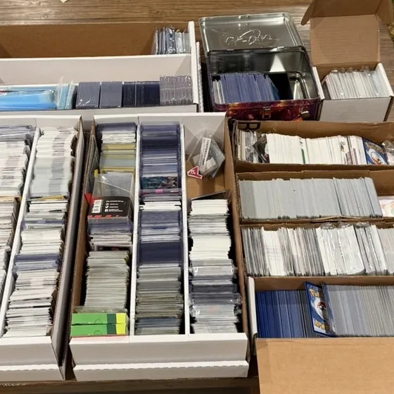 Long boxes full of sorted trading cards from the unit